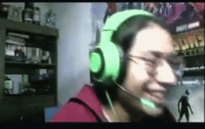 Person Wearing Green Headphones Smiling Into Microphone GIF