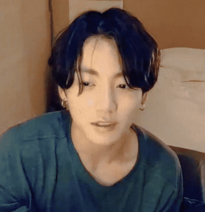 Person Wearing Green Shirt And Earrings GIF