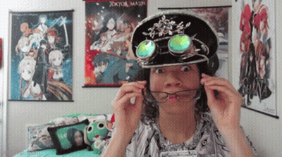 Person Wearing Hat And Goggles In Front Of Tokyo Major Poster GIF