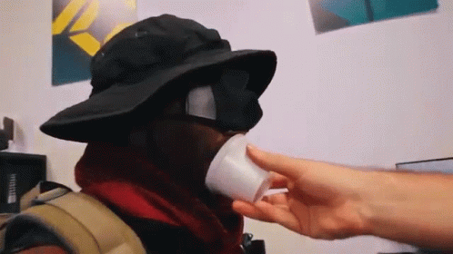 Person Wearing Hat And Sunglasses Drinking GIF