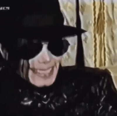 Person Wearing Hat And Sunglasses Smiling GIF