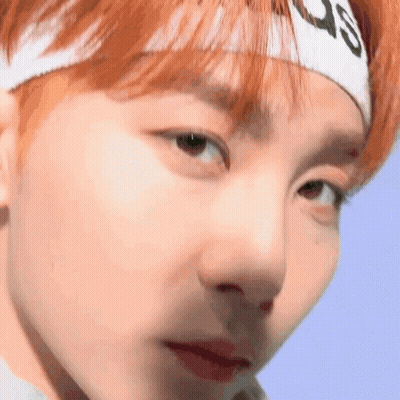 Person Wearing Headband Looking At Camera GIF