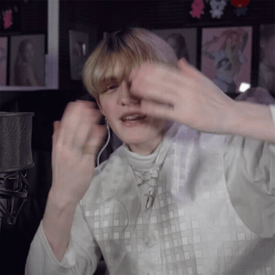Person Wearing Headphones And White Square Shirt GIF