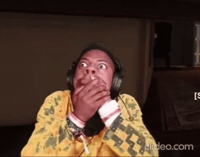 Person Wearing Headphones Covering Mouth GIF