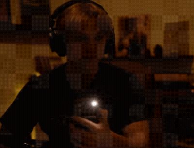 Person Wearing Headphones Taking Selfie GIF