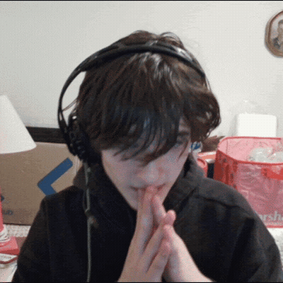 Person Wearing Headphones With Pink Bag GIF
