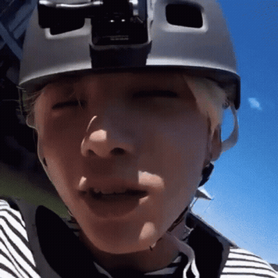 Person Wearing Helmet And Striped Shirt GIF
