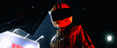 Person Wearing Helmet Next To X Sign GIF
