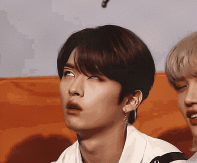 Person Wearing Hoodie And Necklace GIF