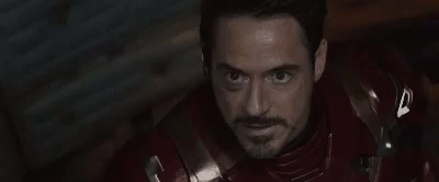 Person Wearing Iron Man Helmet With Blue Eyes GIF