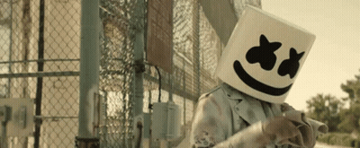 Person Wearing Marshmello Mask In Front Of Chain Link Fence GIF