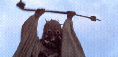 Person Wearing Mask Holding Stick GIF