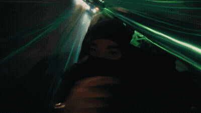 Person Wearing Mask Walking At Night GIF