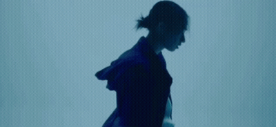 Person Wearing Necklace And Purple Jacket GIF