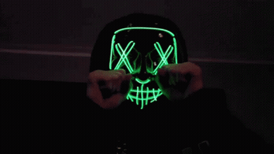 Person Wearing Neon Skull Mask GIF
