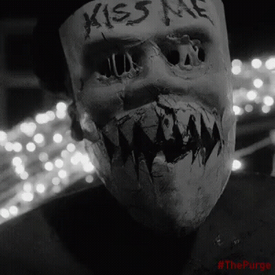 Person Wearing Neon Skull Mask GIF