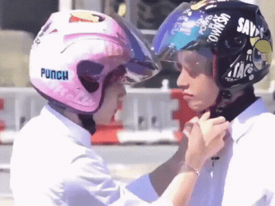 Person Wearing Pink Helmet With Punch