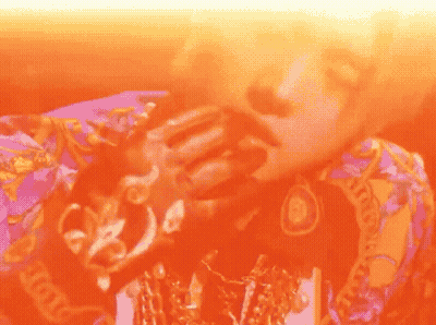 Person Wearing Purple And Orange Versace Shirt GIF