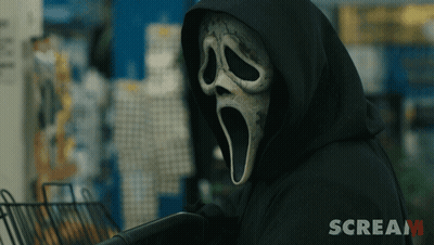 Person Wearing Scream Mask and Black Hood