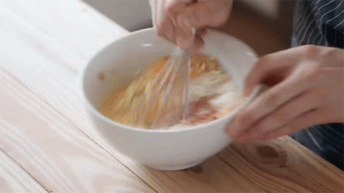 Person Whisking Eggs In White Bowl GIF