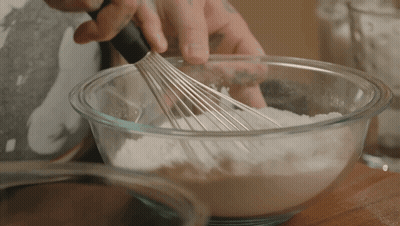 Person Whisking Flour In Bowl GIF