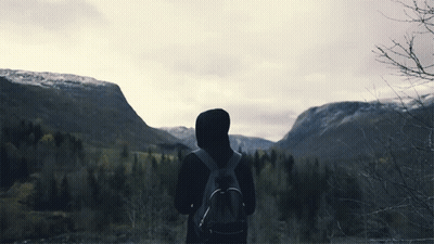 Person With Backpack In Front Of Mountain GIF