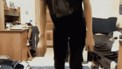 Person With Backpack In Room GIF