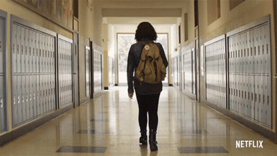Person With Backpack Walking Down Hallway Netflix GIF