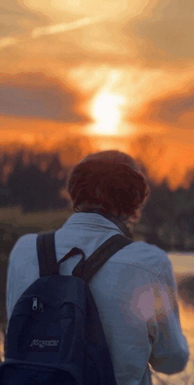 Person With Black Backpack Watching Sunset GIF