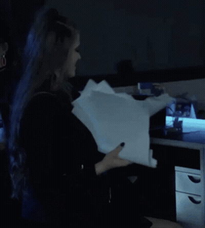 Person With Blue Hair Holding Paper GIF