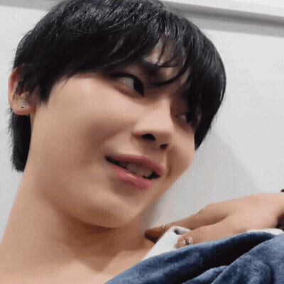 Person With Blue Towel Around Neck GIF