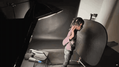 Person With Dreadlocks In Dark Room GIF