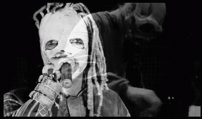 Person With Dreadlocks Singing Into Microphone GIF