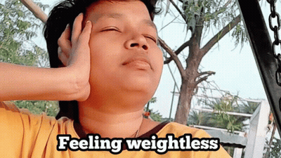Person With Eyes Closed Feeling Weightless GIF