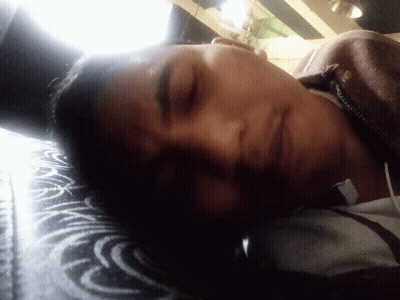 Person With Eyes Closed In Black Shirt GIF