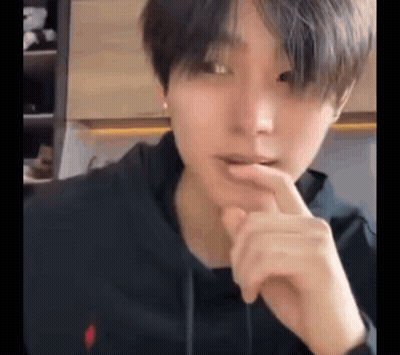 Person With Finger Over Mouth GIF