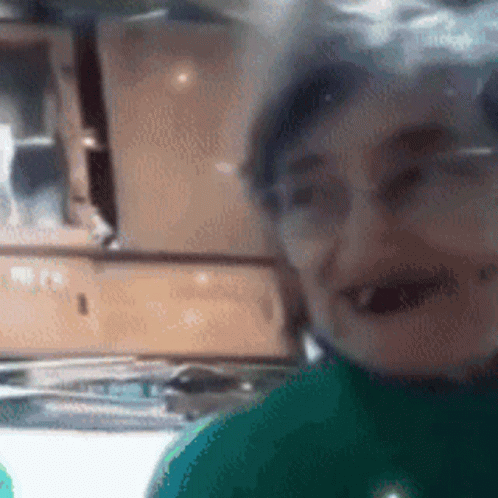 Person With Glasses And Green Shirt GIF