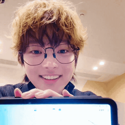 Person With Glasses Smiling At Tablet GIF