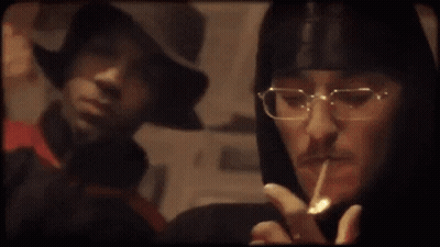 Person With Glasses Smoking Cigarette GIF