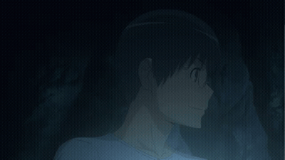 Person With Glowing Eyes Covering Face In Dark GIF