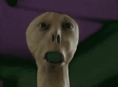 Person With Green Object In Open Mouth GIF