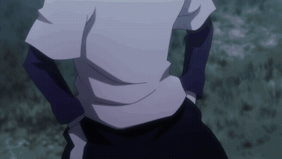 Person With Hands In Pockets Standing In Dark GIF