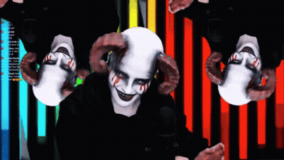 Person With Horns In Front Of Screen Saying A GIF