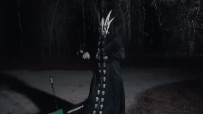 Person With Mask Holding Stick GIF