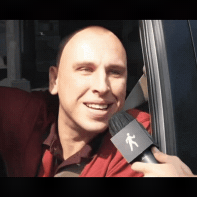 Person With Microphone Interviewing Man In Red Shirt GIF