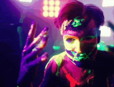 Person With Neon Paint On Face And Body GIF