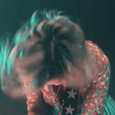 Person With Open Mouth And Star Necklace GIF