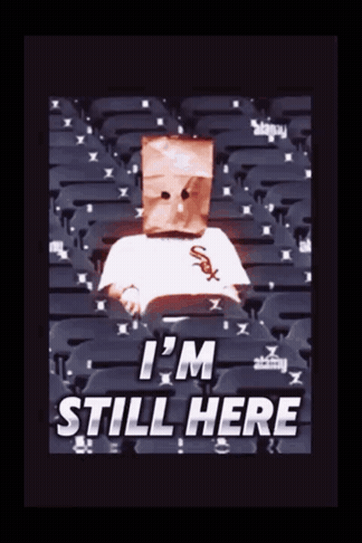 Person With Paper Bag Saying I'm Still Here GIF