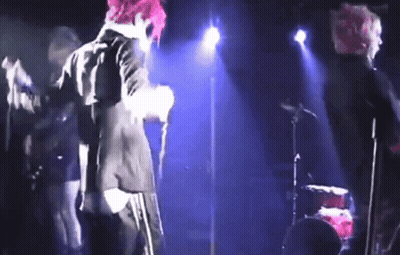 Person With Pink Hair Singing Into Microphone GIF