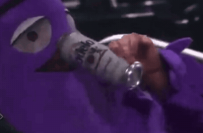 Person With Purple Mask Holding Soda GIF
